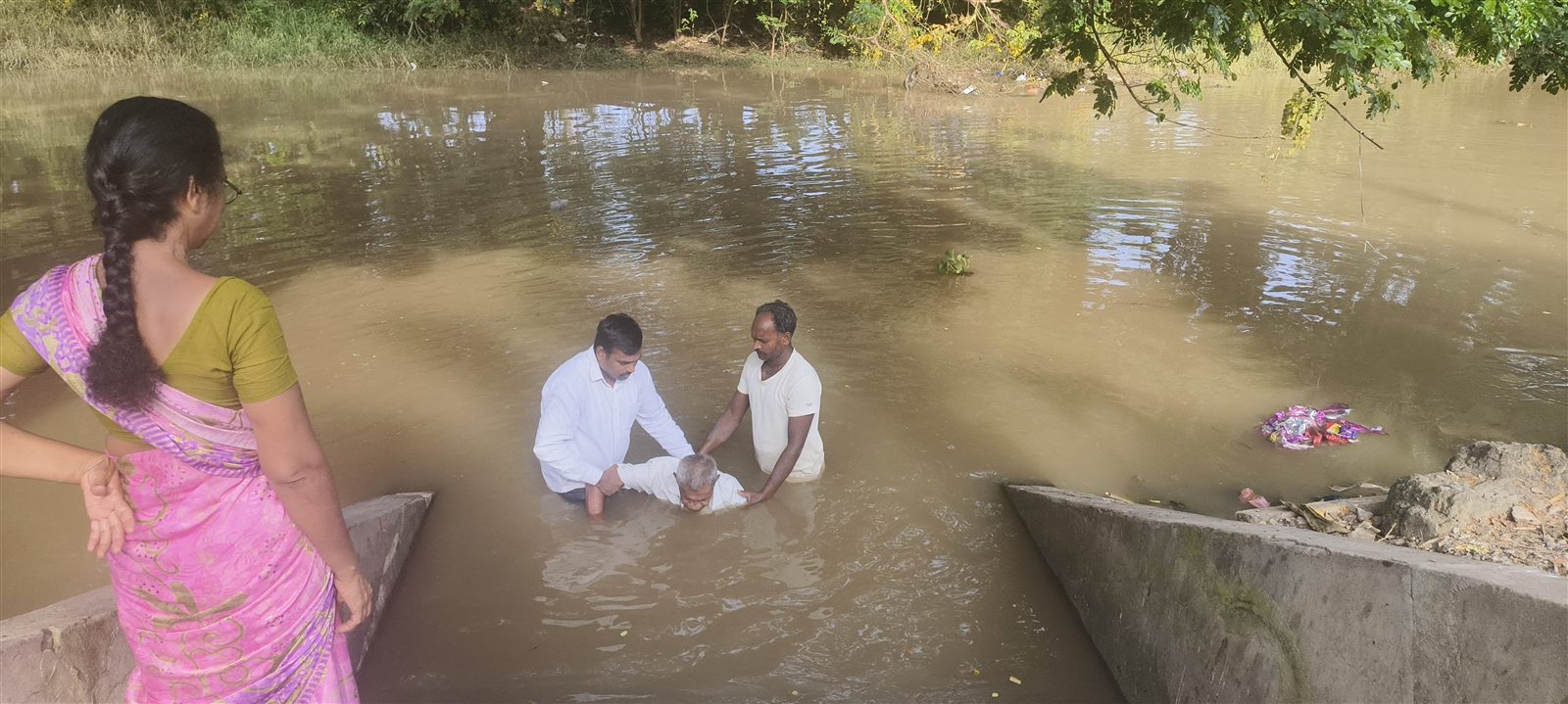Water baptism service in a river